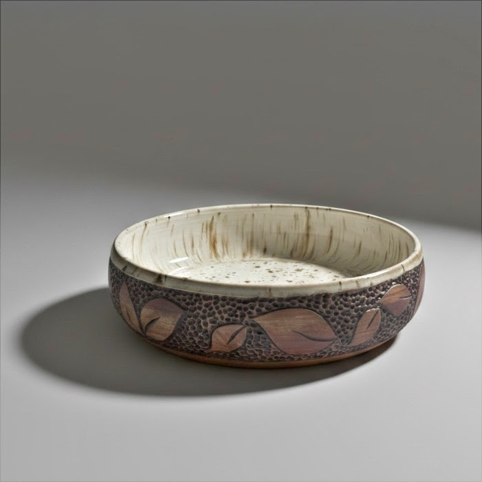 Hand carved stoneware bowl with a leaf relief and speckled glaze, by Denise Paquette