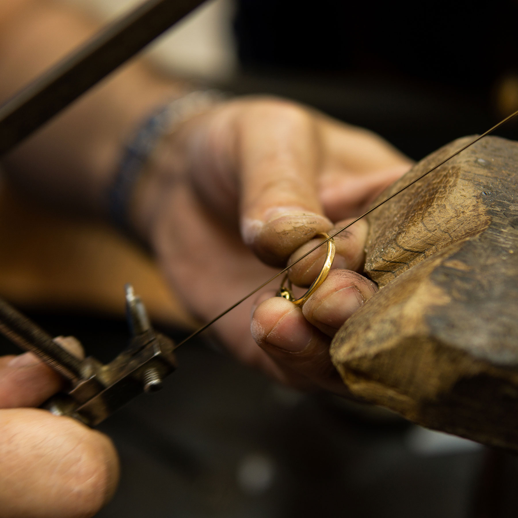 Jeweler Hands at Bench with Hand Saw